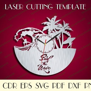 May include: A silver laser cut clock with a surfer riding a wave, palm trees, and the text "Surf the Wave".