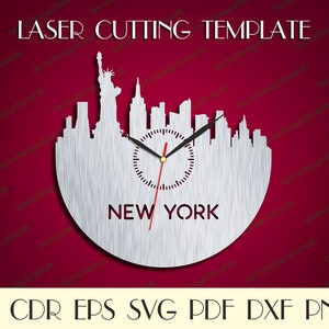May include: A silver-colored laser-cut wall clock featuring the New York City skyline, including the Statue of Liberty. The clock face is integrated into the skyline design, with the word "NEW YORK" below. The text "LASER CUTTING TEMPLATE" is at the top.