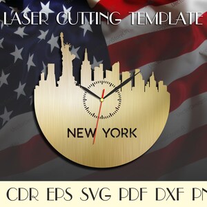 May include: A gold-colored laser-cut clock featuring the New York City skyline, including the Statue of Liberty. The clock hands are black, with a red second hand. The text "NEW YORK" is below the clock face. The words "LASER CUTTING TEMPLATE" are at the top.