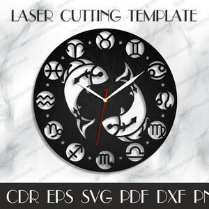 May include: Black and white laser cut clock face with zodiac symbols and a pair of fish representing the Pisces zodiac sign. The clock face is round and has a wood grain texture. The text "LASER CUTTING TEMPLATE" is at the top of the image. The text "AI CDR EPS SVG PDF DXF PNG" is at the bottom of the image.