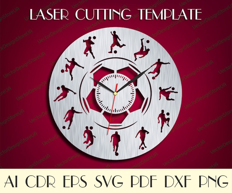 May include: A silver clock face with a soccer ball design. The clock face has 12 soccer players in various poses around the clock face. The clock face is surrounded by a silver ring with the text "LASER CUTTING TEMPLATE" at the top.