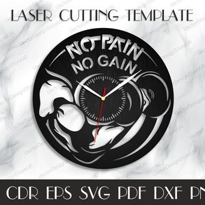 May include: Black and white clock with a weightlifter design. The clock face reads "No Pain No Gain".