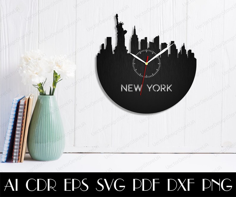 May include: Black wall clock featuring the New York City skyline silhouette. The clock face displays the city's name in silver lettering. The clock hands are white with a red second hand. The clock is mounted on a white wall.