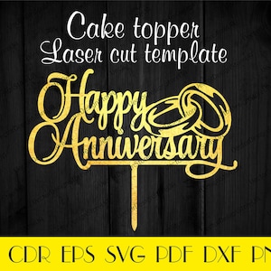 May include: Gold laser cut cake topper with the words "Happy Anniversary" and two interlocking rings. The topper is designed for a wedding or anniversary cake.