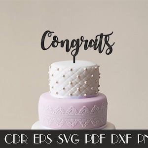 May include: A white and purple cake with a black "Congrats" topper. The cake is decorated with white pearl-like beads and a white lace trim.