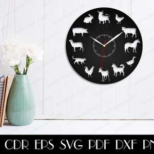 May include: A black clock face with white animal silhouettes around the edge. The animals include a pig, a llama, a cat, a rooster, a goat, a dog, a duck, a rabbit, a bull, a chicken, a cow, and a horse. The clock hands are red and white.