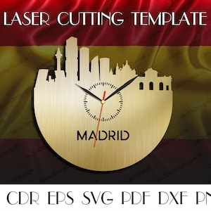 May include: Laser cutting template of the Madrid skyline with a clock face and the word "MADRID" underneath. The template is on a gold background with a red and yellow Spanish flag in the background.