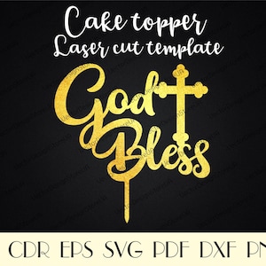 May include: Gold laser cut cake topper with the words "God Bless" and a cross. The topper is designed for a wedding or baptism cake.