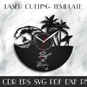 May include: Black and white laser cut design of a clock with a surfer riding a wave, palm trees, and the text "Surf the Wave".