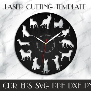 Peut inclure: Un mod&egrave;le de d&eacute;coupe laser d'horloge noir et blanc repr&eacute;sentant diff&eacute;rentes races de chiens. Le cadran de l'horloge est rond et pr&eacute;sente une texture en bois. Le mod&egrave;le comprend le texte "LASER CUTTING TEMPLATE".