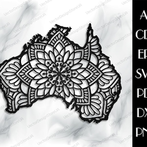 May include: A black and white mandala design in the shape of the continent of Australia. The mandala is intricate and detailed, with a variety of geometric patterns.