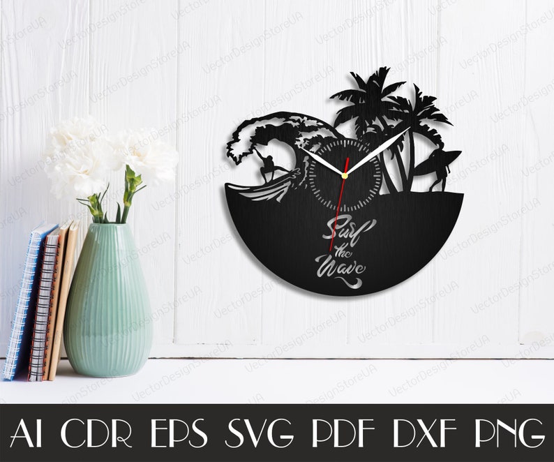May include: Black and white vinyl record clock with a surfer riding a wave and palm trees. The clock face says "Surf the Wave".