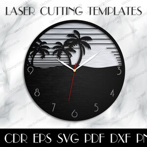 May include: Black and white laser-cut wall clock featuring a tropical beach scene with palm trees and a sunset. The clock has a round shape with the numbers 3, 4, 5, 7, 8, and 9 visible. The text "LASER CUTTING TEMPLATES" is at the top.