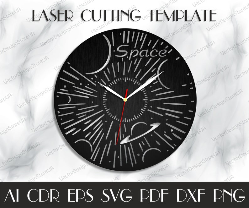 May include: A black clock face with a white and silver space-themed design. The clock face has a sun, planets, and stars. The text "Space" is written on the clock face.