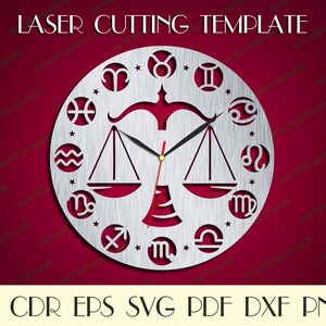 May include: A silver laser cut clock template featuring the zodiac signs and a scale design. The template is labelled "LASER CUTTING TEMPLATE" and "AI CDR EPS SVG PDF DXF PNG".