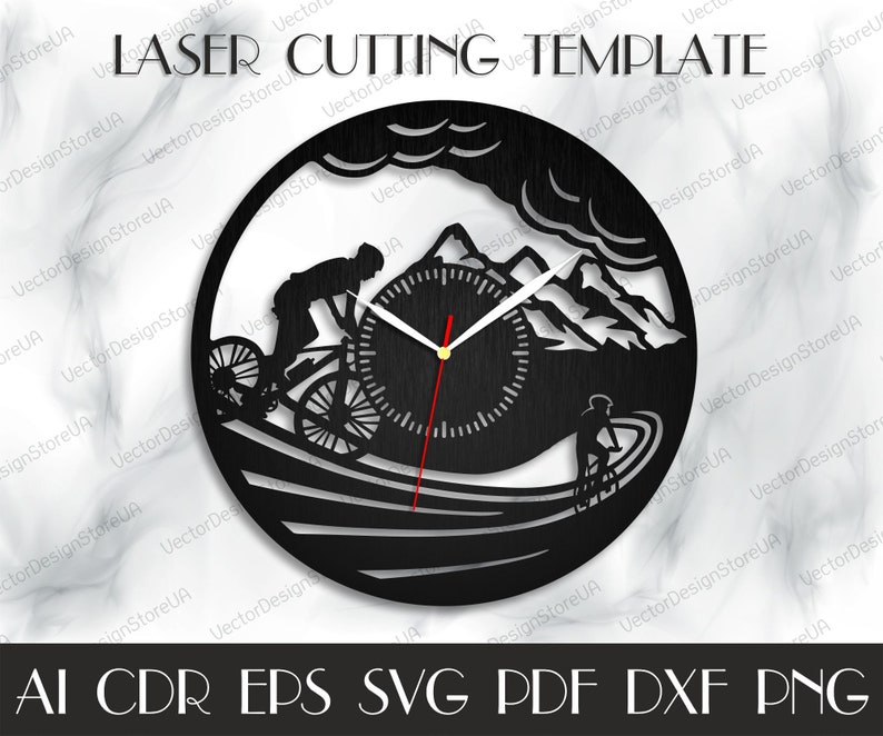 May include: Black and white laser cut design of a mountain biker riding through a mountain landscape. The design includes a clock face with hands. The text "LASER CUTTING TEMPLATE" is at the top of the design.
