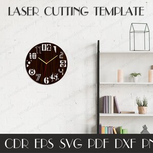 May include: A laser cutting template for a wooden clock. The clock has a dark brown face with white cut-out numbers and a deer silhouette. The clock hands are gold. The words "LASER CUTTING TEMPLATE" are above the clock. Below the clock are file type abbreviations.