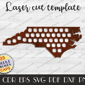 May include: A laser cut template of the state of North Carolina with 35 circles for bottle caps. The template is made of brown wood and is 24 inches by 9.4 inches. The template is available in AI, CDR, EPS, SVG, PDF, DXF, and PNG formats.