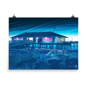 May include: A blue and white illustration of a pier with a building that says "AVON PIER" in pink neon letters. The pier is over the water and there are stars in the sky.