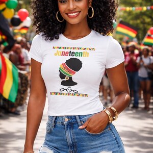 May include: A white t-shirt with the word "Juneteenth" and a graphic of a woman's silhouette wearing a head wrap. The woman is wearing blue denim shorts and gold jewelry. The background includes flags and people.