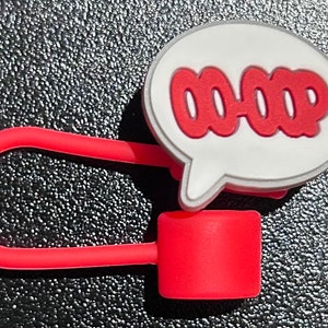 May include: Red and white cable organizer with a speech bubble that says "OOPS".