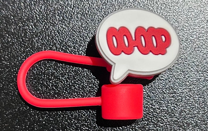 May include: Red and white cable organizer with a speech bubble that says "OOPS".