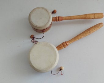 Drum with two balls on strings hotsell