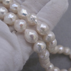 AAA Baroque Pearl Strand: 9-10mm Natural White Freshwater Pearls