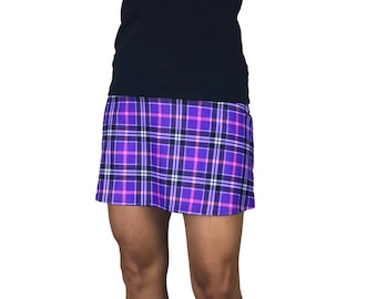 May include: A purple and pink plaid skirt with a black and white plaid pattern. The skirt is short and has a fitted silhouette.