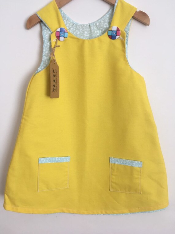 girls yellow pinafore