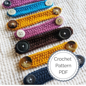 May include: A set of colorful crocheted mask extenders with buttons. The extenders are in various colors, including pink, blue, yellow, brown, and gold. The buttons are a mix of white, black, and brown. The text "Crochet Pattern PDF" is visible in the image.