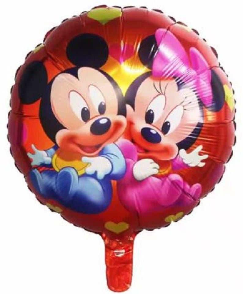 May include: A red, round foil balloon featuring Mickey Mouse and Minnie Mouse. Mickey is wearing blue and yellow, while Minnie is in pink. The balloon has a red stem and is decorated with hearts and other shapes.