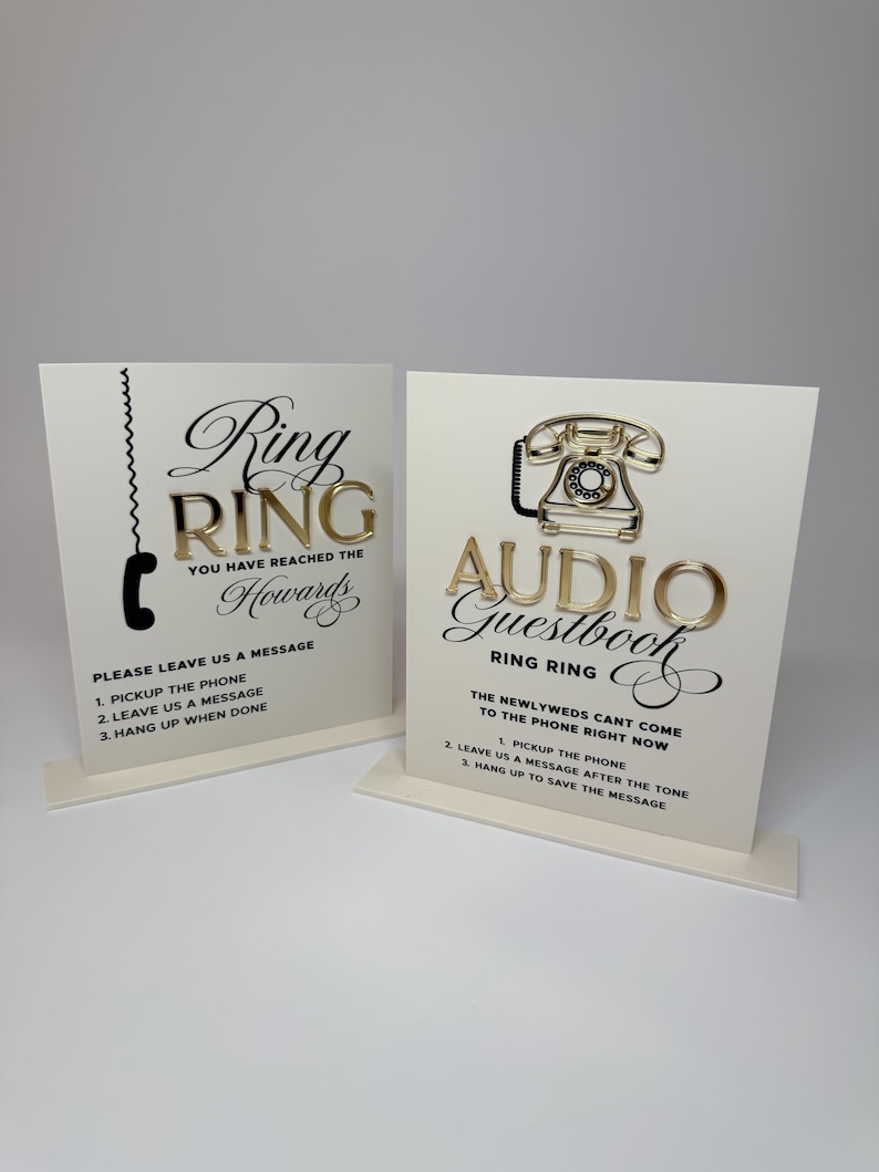 Puede incluir: Dos letreros de boda color crema con letras y detalles dorados. Un letrero dice "Ring Ring" con instrucciones para dejar un mensaje. El otro dice "Audio Guestbook" con instrucciones. Ambos letreros tienen un gr&aacute;fico de tel&eacute;fono.