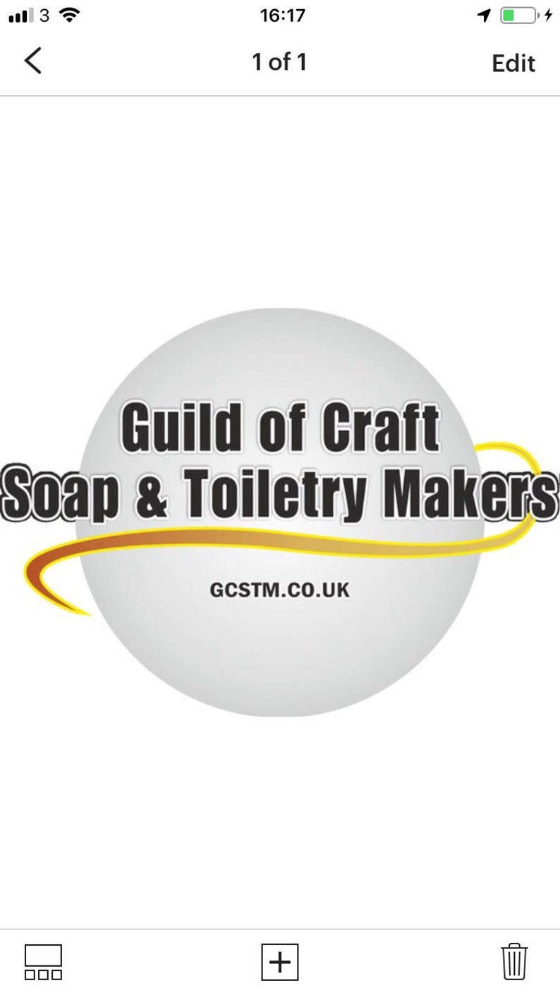 May include: A white circle with a gold curved line around it. The text "Guild of Craft Soap & Toiletry Makers" is in black text on the circle. The text "GCSTM.CO.UK" is in black text below the circle.