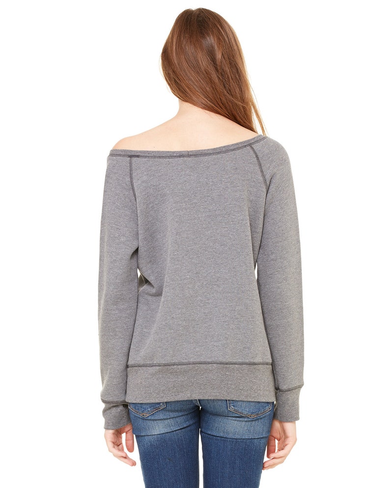 May include: A heather gray off-the-shoulder sweatshirt with long sleeves and a relaxed fit.
