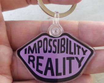 Nomanita Sense8 Keychain - "Impossibility is a kiss away from reality."