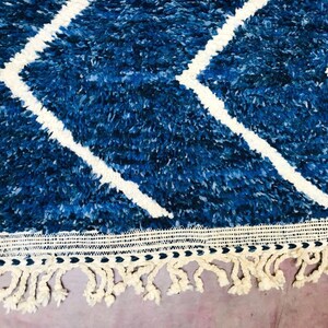 This custom Beni ourain rug has been handmade in Morocco with natural wool sheep. This Beni ourain rug is so soft, thick, and fluffy. That makes sitting so comfortable, and this Berber carpet will also warm you during winter.