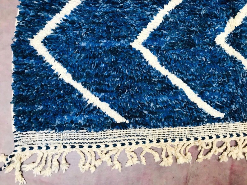 This custom Beni ourain rug has been handmade in Morocco with natural wool sheep. This Beni ourain rug is so soft, thick, and fluffy. That makes sitting so comfortable, and this Berber carpet will also warm you during winter.