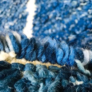 This custom Beni ourain rug has been handmade in Morocco with natural wool sheep. This Beni ourain rug is so soft, thick, and fluffy. That makes sitting so comfortable, and this Berber carpet will also warm you during winter.