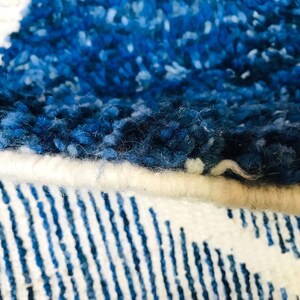 This custom Beni ourain rug has been handmade in Morocco with natural wool sheep. This Beni ourain rug is so soft, thick, and fluffy. That makes sitting so comfortable, and this Berber carpet will also warm you during winter.