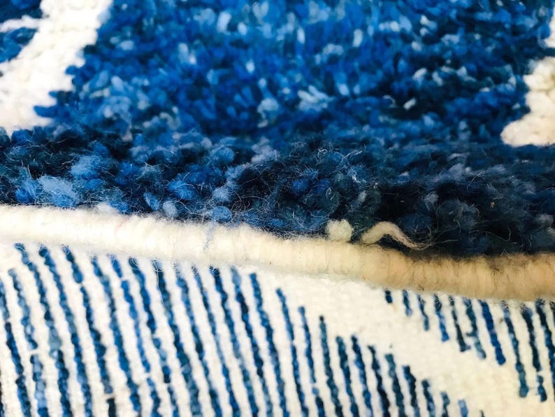 This custom Beni ourain rug has been handmade in Morocco with natural wool sheep. This Beni ourain rug is so soft, thick, and fluffy. That makes sitting so comfortable, and this Berber carpet will also warm you during winter.