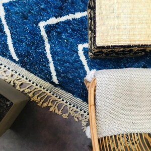 This custom Beni ourain rug has been handmade in Morocco with natural wool sheep. This Beni ourain rug is so soft, thick, and fluffy. That makes sitting so comfortable, and this Berber carpet will also warm you during winter.