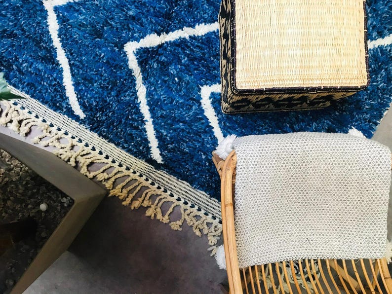This custom Beni ourain rug has been handmade in Morocco with natural wool sheep. This Beni ourain rug is so soft, thick, and fluffy. That makes sitting so comfortable, and this Berber carpet will also warm you during winter.