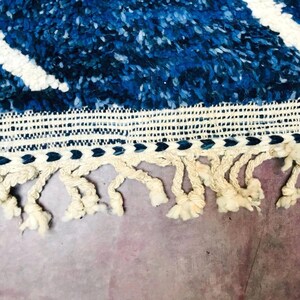 This custom Beni ourain rug has been handmade in Morocco with natural wool sheep. This Beni ourain rug is so soft, thick, and fluffy. That makes sitting so comfortable, and this Berber carpet will also warm you during winter.
