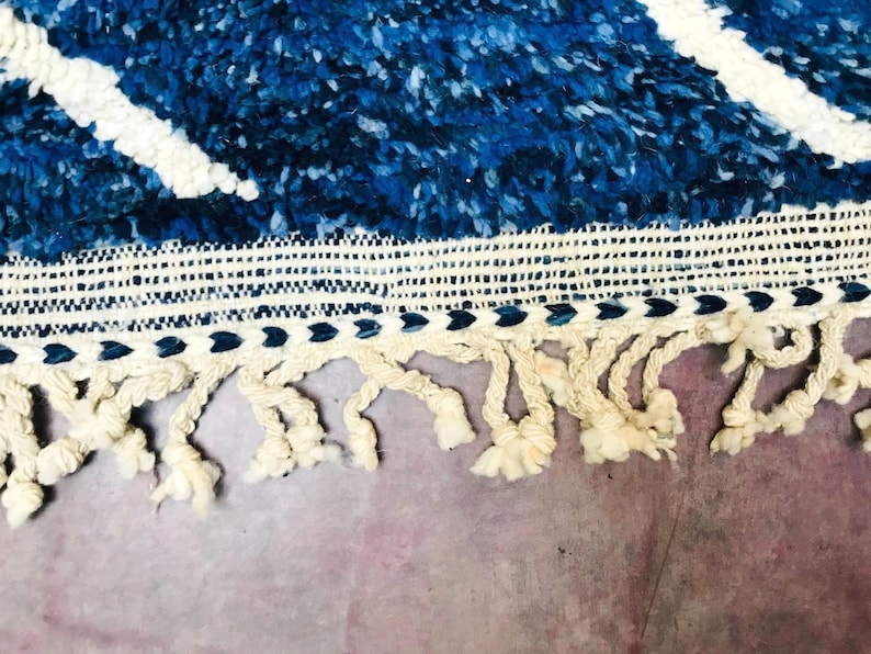 This custom Beni ourain rug has been handmade in Morocco with natural wool sheep. This Beni ourain rug is so soft, thick, and fluffy. That makes sitting so comfortable, and this Berber carpet will also warm you during winter.
