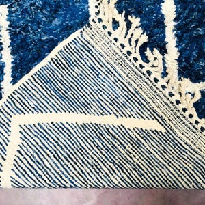 This custom Beni ourain rug has been handmade in Morocco with natural wool sheep. This Beni ourain rug is so soft, thick, and fluffy. That makes sitting so comfortable, and this Berber carpet will also warm you during winter.