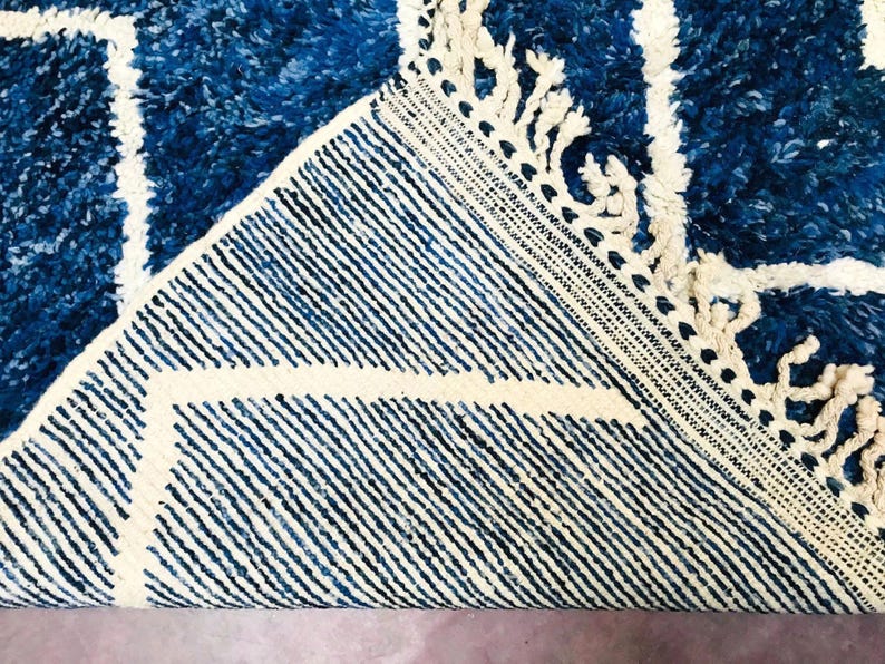 This custom Beni ourain rug has been handmade in Morocco with natural wool sheep. This Beni ourain rug is so soft, thick, and fluffy. That makes sitting so comfortable, and this Berber carpet will also warm you during winter.