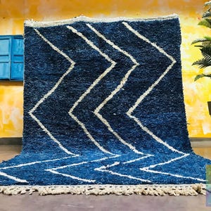 This custom Beni ourain rug has been handmade in Morocco with natural wool sheep. This Beni ourain rug is so soft, thick, and fluffy. That makes sitting so comfortable, and this Berber carpet will also warm you during winter.