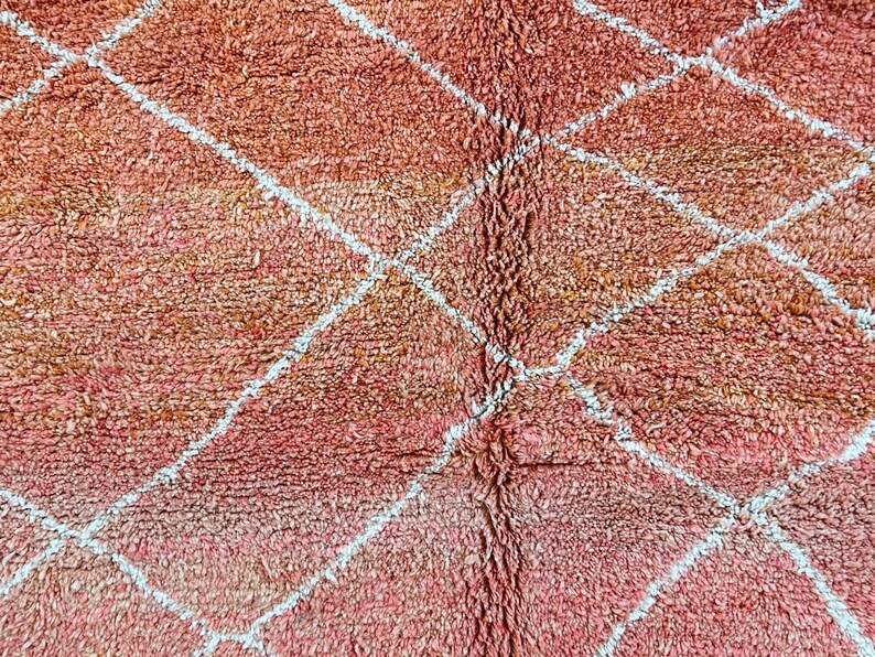 Artistic Moroccan area rug featuring traditional craftsmanship.