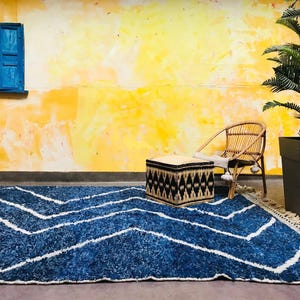This custom Beni ourain rug has been handmade in Morocco with natural wool sheep. This Beni ourain rug is so soft, thick, and fluffy. That makes sitting so comfortable, and this Berber carpet will also warm you during winter.